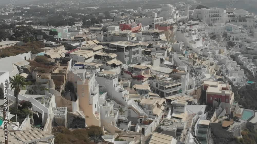 Drone from above view of white houses, hotels with pools and churches in Fira, Santorini Island, Greece. Thira city. Aegean Sea, Mediterranean. Panoramic aerial drone view from above
Drone from above view of white houses, hotels with pools and churches in Fira, Santorini Island, Greece. Thira city. Aegean Sea, Mediterranean. Panoramic aerial drone view from above