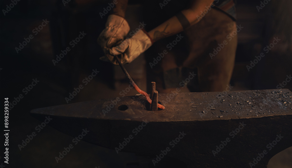 Foundry, hands and heat with blacksmith in metal workshop for industrial manufacturing or production. Fire, forge and tool with professional artisan in factory for industry, trade or welding steel Foundry, hands and heat with blacksmith in metal workshop for industrial manufacturing or production. Fire, forge and tool with professional artisan in factory for industry, trade or welding steel