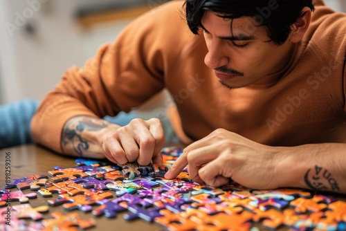 Solving the Puzzle of Relaxation: Man in Lucky Orange Engaged in Mental Stimulation