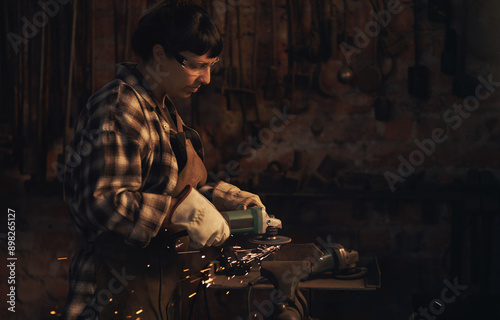 Wallpaper Mural Welding, woman and blacksmith with grinder, sparks and skills for project, startup and workshop. Person, entrepreneur and business owner with equipment, warehouse and productivity with industry Torontodigital.ca