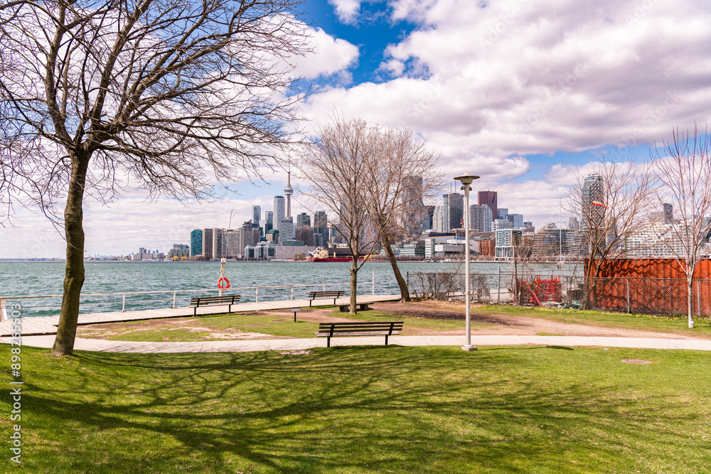 Fototapeta premium Toronto waterfront and skyline seen from a city park in spring room for text