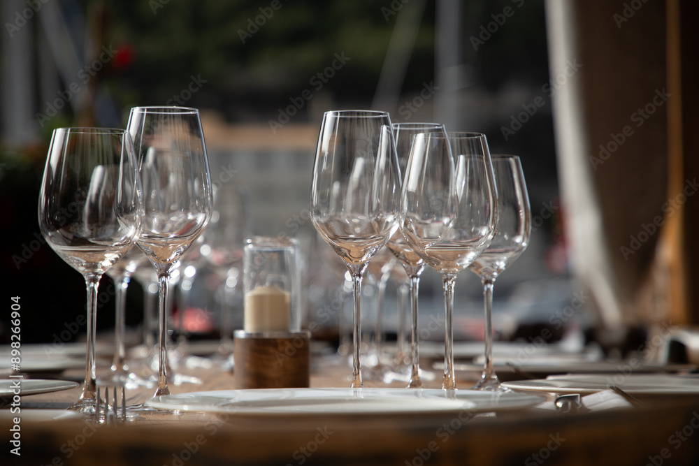 wine glasses on table in fancy restaurant by the sea wine glasses on table in fancy restaurant by the sea