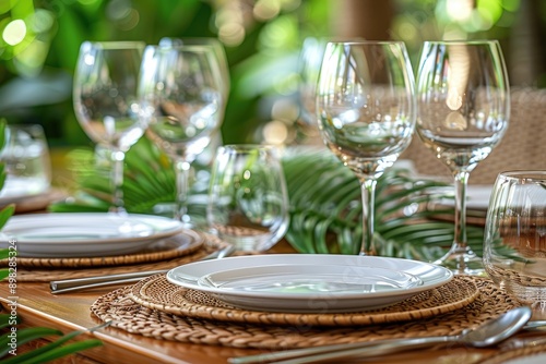 Close-up of a Table Setting with White Plates and Wine Glasses