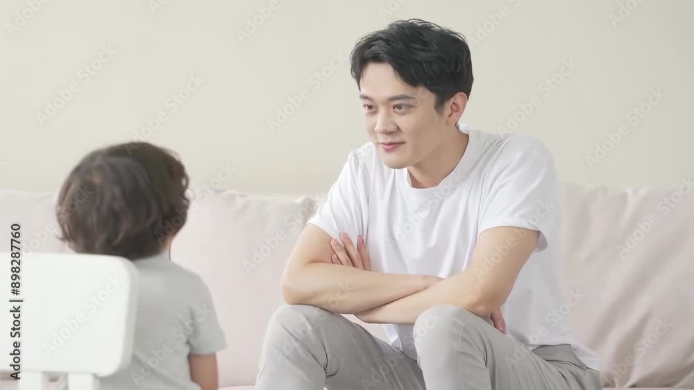 Happy family father, child son chatting and play games joyful atmosphere toys together at home, enjoying leisure time in living room Happy family father, child son chatting and play games joyful atmosphere toys together at home, enjoying leisure time in living room