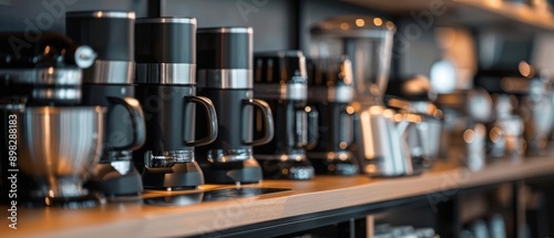 Row of black coffee makers on a shelf © narak0rn
