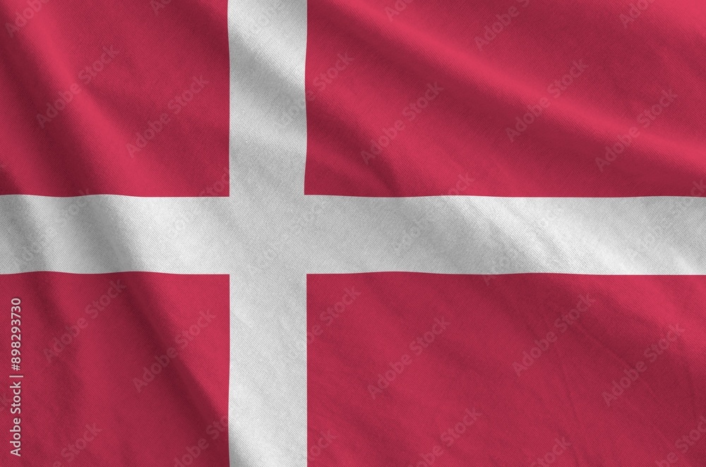 Denmark flag depicted on folded wavy fabric of old cloth close up Denmark flag depicted on folded wavy fabric of old cloth close up