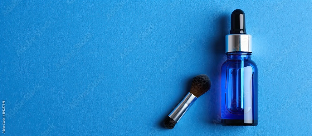 Blank blue eye dropper bottle for cosmetic peels with brush label and room for text copy space image Blank blue eye dropper bottle for cosmetic peels with brush label and room for text copy space image