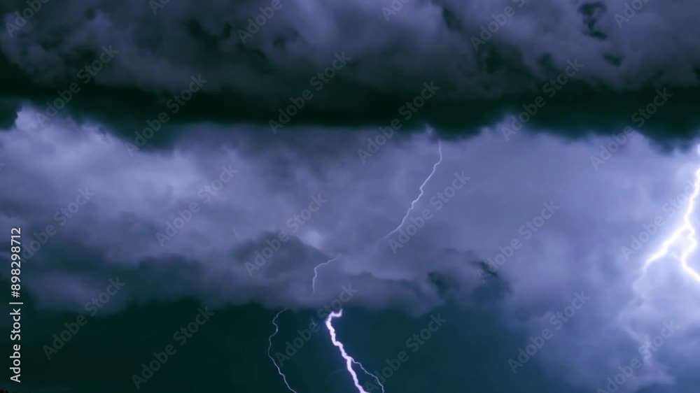 Lightning discharge and light effects in the clouds. Thunderclouds in bright flashes of lightning. Bad weather. Looped . Dark storm 4k Lightning discharge and light effects in the clouds. Thunderclouds in bright flashes of lightning. Bad weather. Looped . Dark storm 4k
