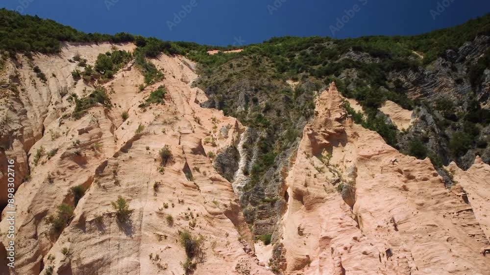 Geological wonder with red rock walls and eroded rock pinnacles. Lame Rosse in the Fiastra lake area, Marche, Italy Geological wonder with red rock walls and eroded rock pinnacles. Lame Rosse in the Fiastra lake area, Marche, Italy