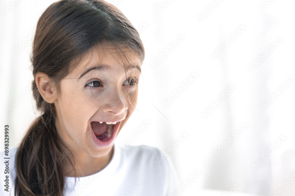 Happy teenage girl with her mouth wide open in a smile on a white background. Happy teenage girl with her mouth wide open in a smile on a white background.