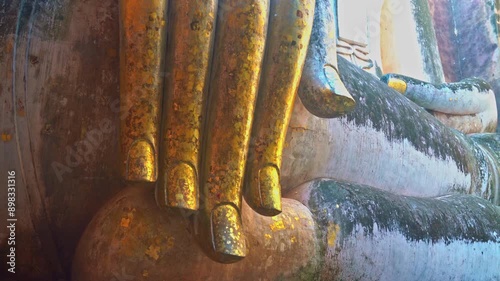 Giant Statue of A Seated Buddha With Tapered Fingers Covered With Gold
Finger of Phra Ajana at Wat Si Chum, in Sukhothai historical park, Sukhothai
The most Beautiful Finger Buddha statue. photo