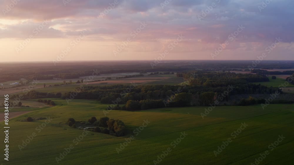 Beautiful view of a field in the countryside among nature with grass and forests. Aerial shot Beautiful view of a field in the countryside among nature with grass and forests. Aerial shot