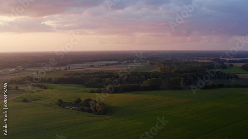 Wallpaper Mural Beautiful view of a field in the countryside among nature with grass and forests. Aerial shot Torontodigital.ca