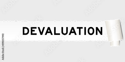 Ripped gray paper background that have word devaluation under torn part