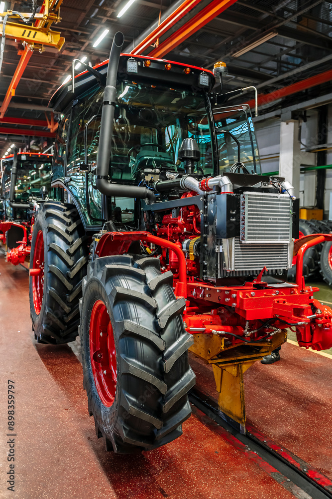 Tractor industry manufacture. New tractors on factory line. Production of agricultural machinery Tractor industry manufacture. New tractors on factory line. Production of agricultural machinery