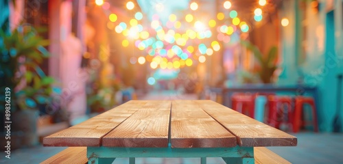 Wooden Table, Nostalgic Outdoor Cafe Ambiance with Colorful Lights in Vintage Retro City Setting