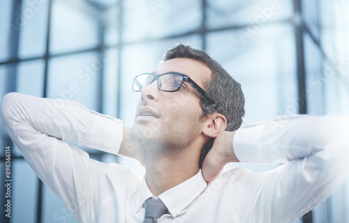 relaxed Caucasian young male rest in chair distracted from computer work, relieve negative emotions.