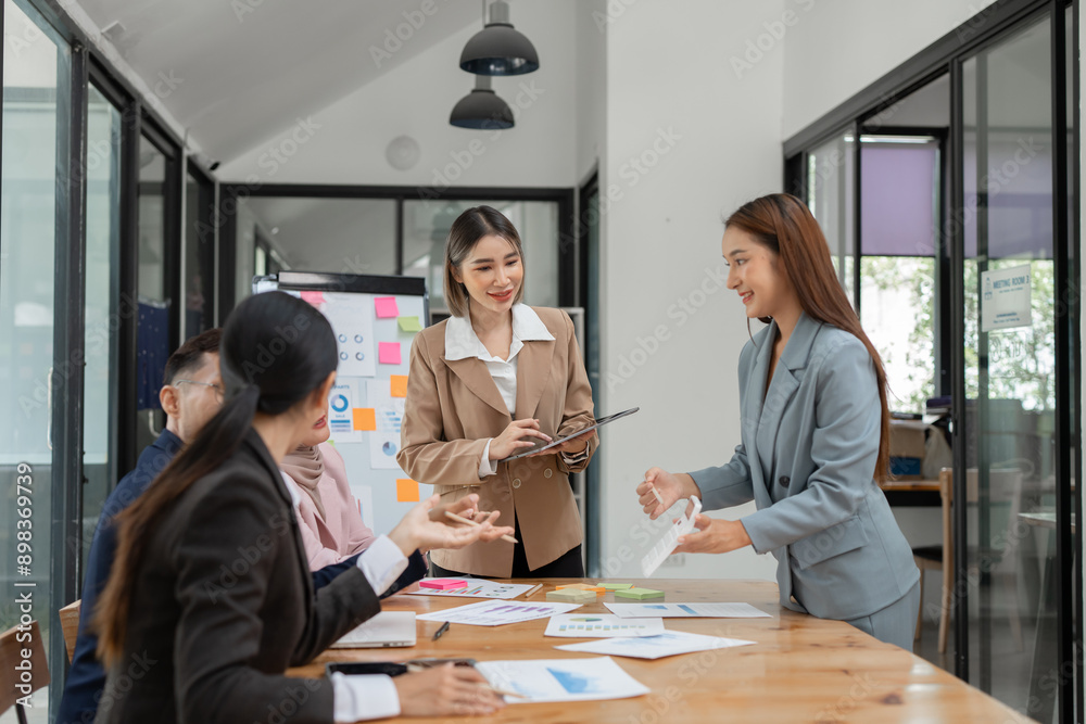 Asia business meeting consultations of business people in the company's meeting room. Asia business meeting consultations of business people in the company's meeting room.