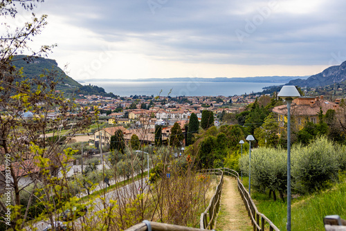 view over italian city with walkway and lake