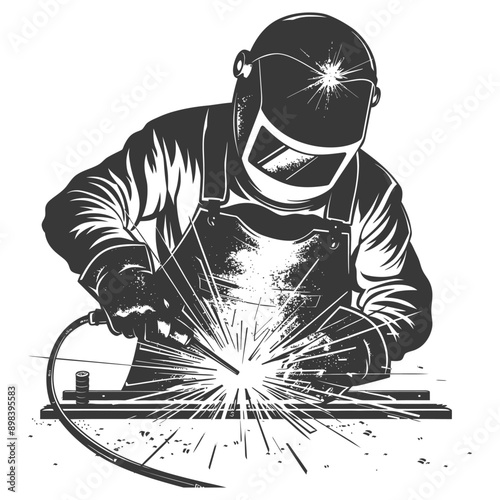 Welder in Protective Gear Working with a Torch