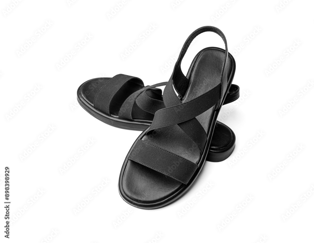 Women's black leather sandals isolated on white background.