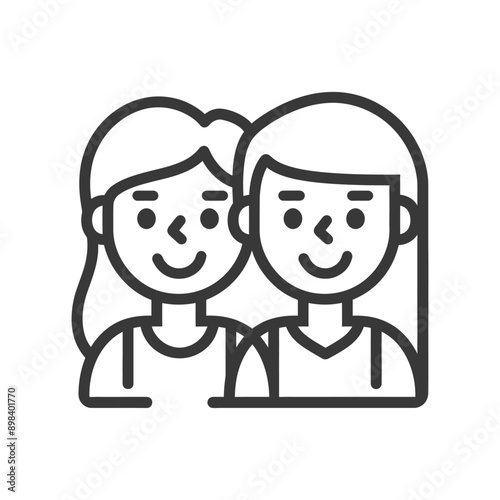 Two smiling women with long hair side by side