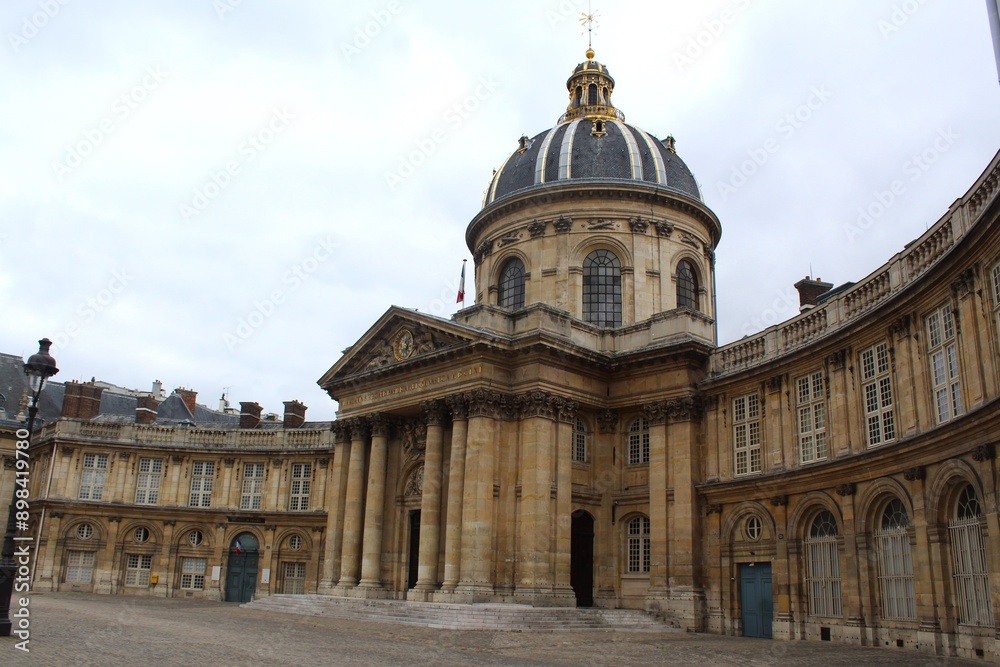 Obraz premium The Institute of France in daylight in Paris, France