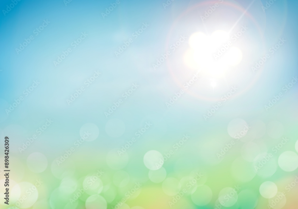A fresh, bright but warm spring and summer blue sky background with sun flare to the right with blurred bokeh foliage.