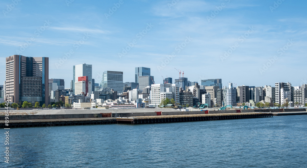 Tokyo city skyline, waterfront skyscrapers against blue sky, Japan capital cityscape Tokyo city skyline, waterfront skyscrapers against blue sky, Japan capital cityscape
