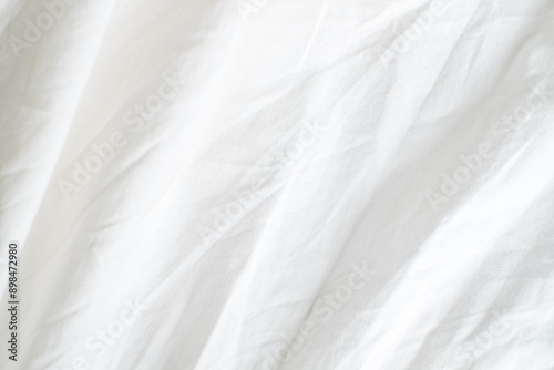 Abstract White Bedding Sheets or White wrinkled fabric background texture and Texture with copy-space :Creased or wrinkled white fabric,Soft focus