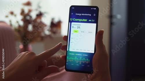 Monitoring the household solar energy system. Examining power production and consumption data in an energy-efficiency smartphone app. Fictional interface.