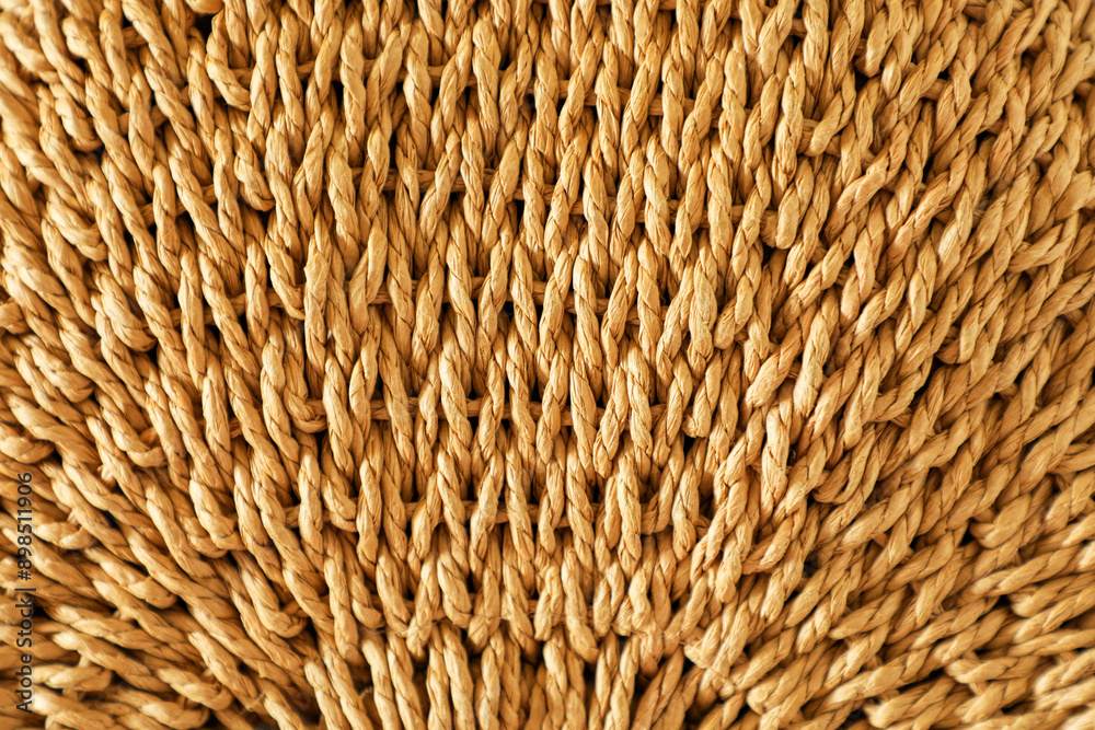 Textured background woven from large natural wheat-colored fibers Textured background woven from large natural wheat-colored fibers