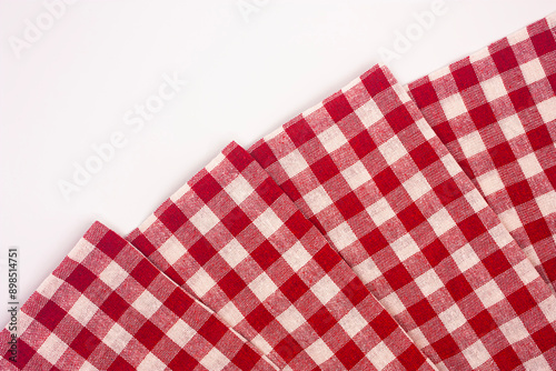 Photo of a traditional tablecloth in red and white and checkered.