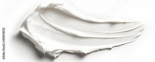 Smooth white cream swatch, isolated on white background photo