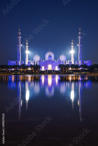 View of Grand Mosque in Abu Dhabi during blue hour t. Beautifull  blue sky and reflections.