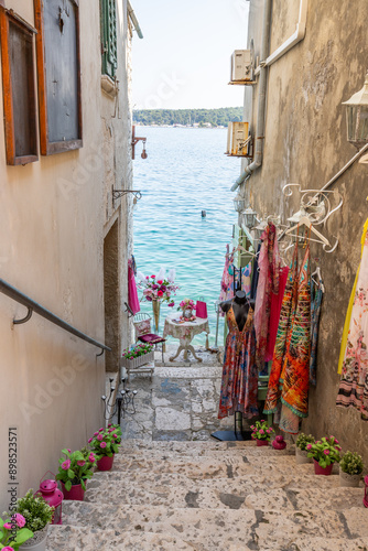Fototapeta Naklejka Na Ścianę i Meble -  Old historical dreamy streets. Beautiful houses and businesses in a romantic tourist location. Beautifully landscaped streets and small squares in Rovinj, Istria, Croatia
