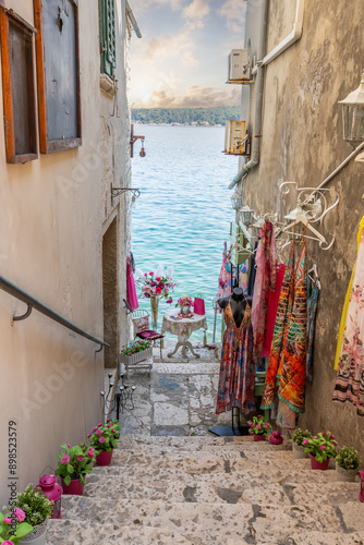 Fototapeta Naklejka Na Ścianę i Meble -  Old historical dreamy streets. Beautiful houses and businesses in a romantic tourist location. Beautifully landscaped streets and small squares in Rovinj, Istria, Croatia