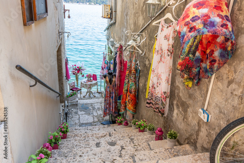 Fototapeta Naklejka Na Ścianę i Meble -  Old historical dreamy streets. Beautiful houses and businesses in a romantic tourist location. Beautifully landscaped streets and small squares in Rovinj, Istria, Croatia
