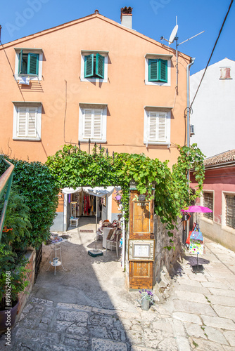Fototapeta Naklejka Na Ścianę i Meble -  Old historical dreamy streets. Beautiful houses and businesses in a romantic tourist location. Beautifully landscaped streets and small squares in Rovinj, Istria, Croatia