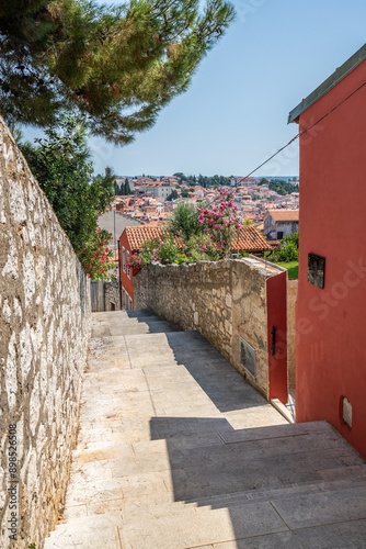 Fototapeta Naklejka Na Ścianę i Meble -  Old historical dreamy streets. Beautiful houses and businesses in a romantic tourist location. Beautifully landscaped streets and small squares in Rovinj, Istria, Croatia