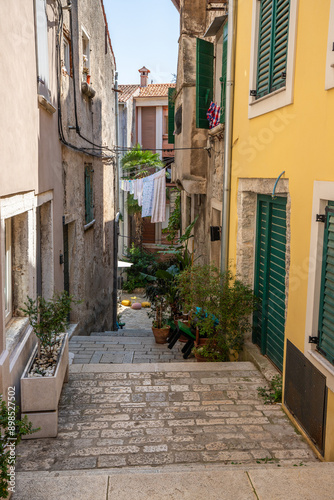 Fototapeta Naklejka Na Ścianę i Meble -  Old historical dreamy streets. Beautiful houses and businesses in a romantic tourist location. Beautifully landscaped streets and small squares in Rovinj, Istria, Croatia