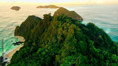 View from the dran, flight over tropical islands with green jungles and white beaches and clear blue waters.
Concept: exotic vacation and ecotourism photo