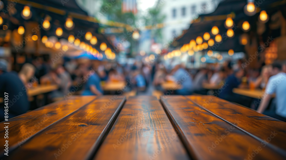 close up of empty wooden table with blurred people celebrate oktoberfest background close up of empty wooden table with blurred people celebrate oktoberfest background