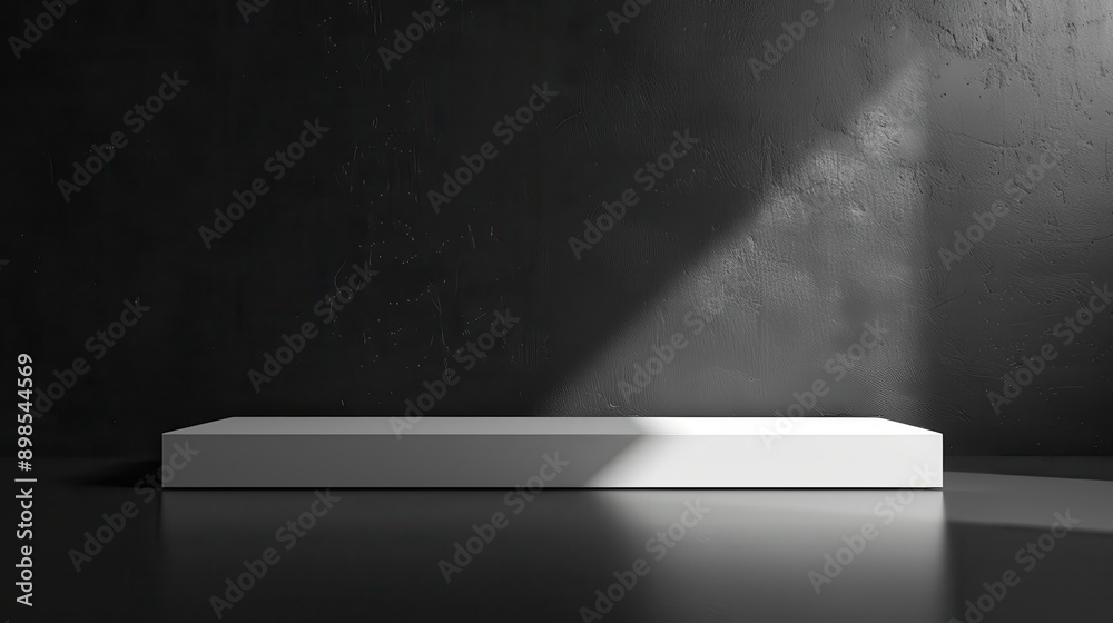 A white pedestal is in front of a black wall A white pedestal is in front of a black wall