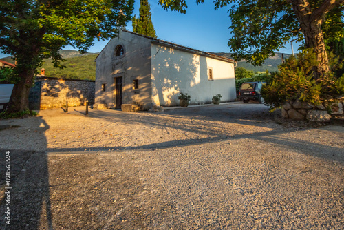 Fototapeta Naklejka Na Ścianę i Meble -  Old historical dreamy streets. Beautiful houses and businesses in a romantic tourist location. Beautifully landscaped streets and small squares in Brseč, Istria, Croatia