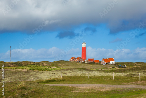 Panorama with scenic view of Lighthouse and rainy clouds at Waddenisland Texel, North Holland, Netherlands photo