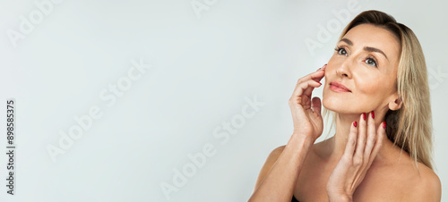 Gorgeous 50s mid middle aged mature woman isolated on white background. Healthy face skin care beauty. Old lady close up smile portrait. Anti age concept for Skincare, Cosmetics Product, web banner