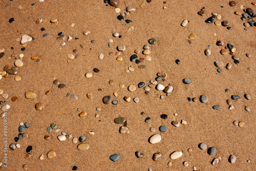 Numerous stones accumulating along the beach at Kohler-Andrae State Park, Sheboygan, Wisconsin