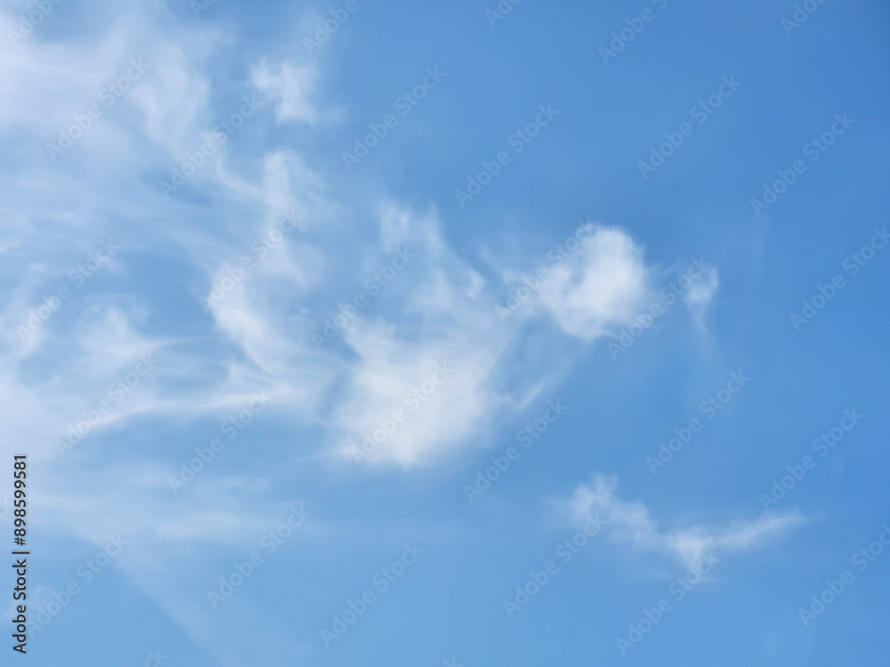 Beautiful blue sky and feathery white clouds nice bright day Beautiful blue sky and feathery white clouds nice bright day