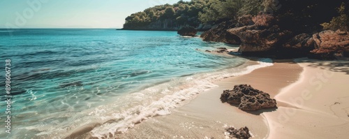 Secluded beach with crystal clear turquoise water and white sand. photo